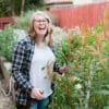 Amanda Kitaura with flowers grown in Bloom Sacramento's suburban farm.