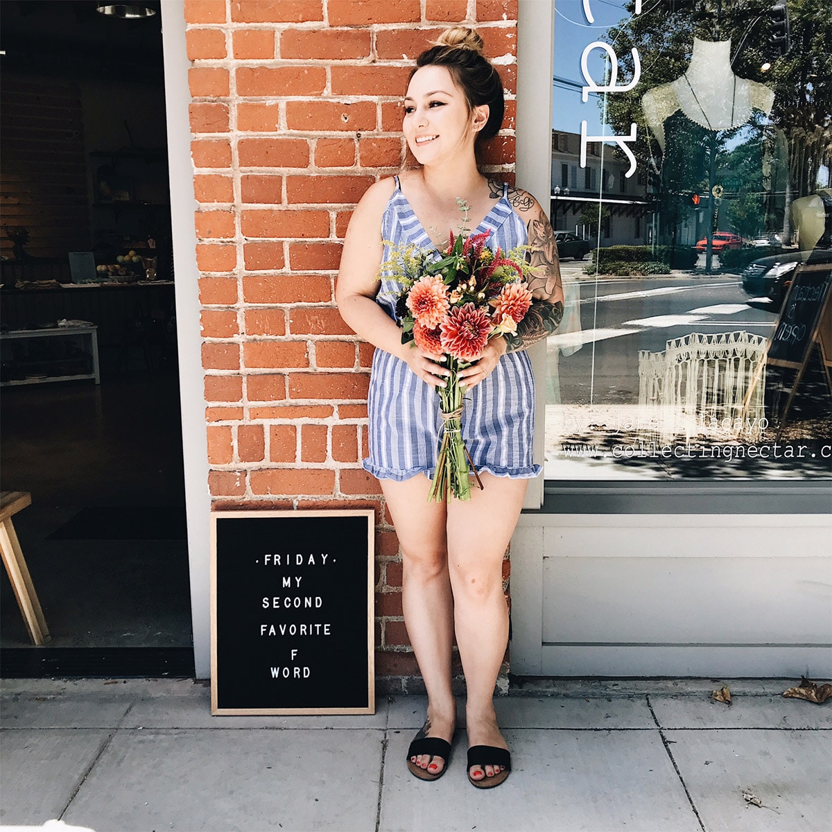 Rire Sacramento worker holding Bloom and Bloomonade bouquet