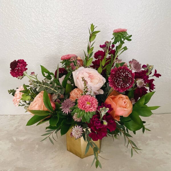 Valentine's Day bouquet arranged by Bloom Sacramento in gold, hexagonal vase.