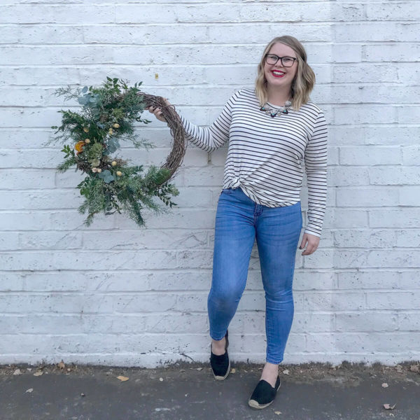 Amanda of Bloom Sacramento holds a wreath.