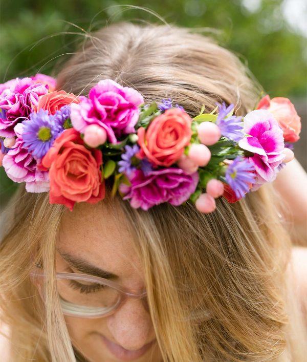 Close up photo of woman wearing flower crown