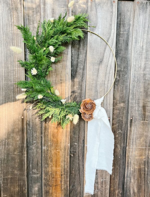 Wreath from Bloom Sacramento made with gold base hangs on door