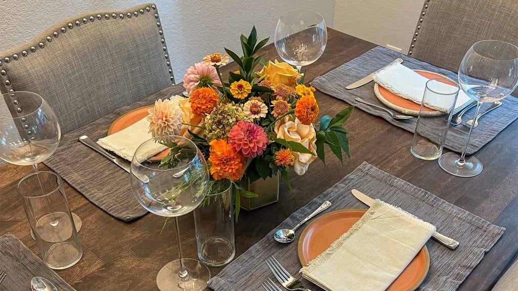 Formal table setting with flower centerpiece by Bloom Sacramento