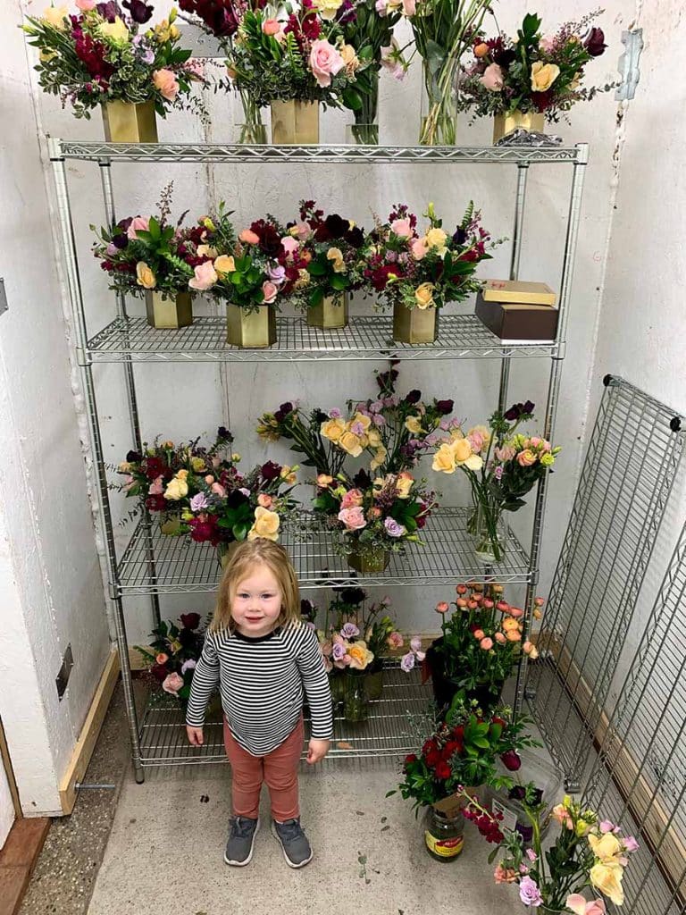 Hallie with flowers inside cooler