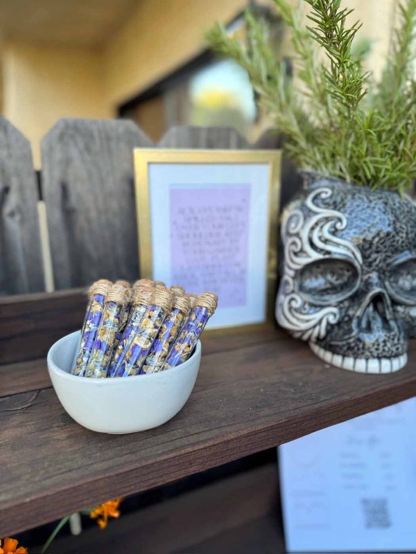 Bowl of dried flower "potions" at workshop hosted by Bloom Sacramento. A skull vase is visible in the background.